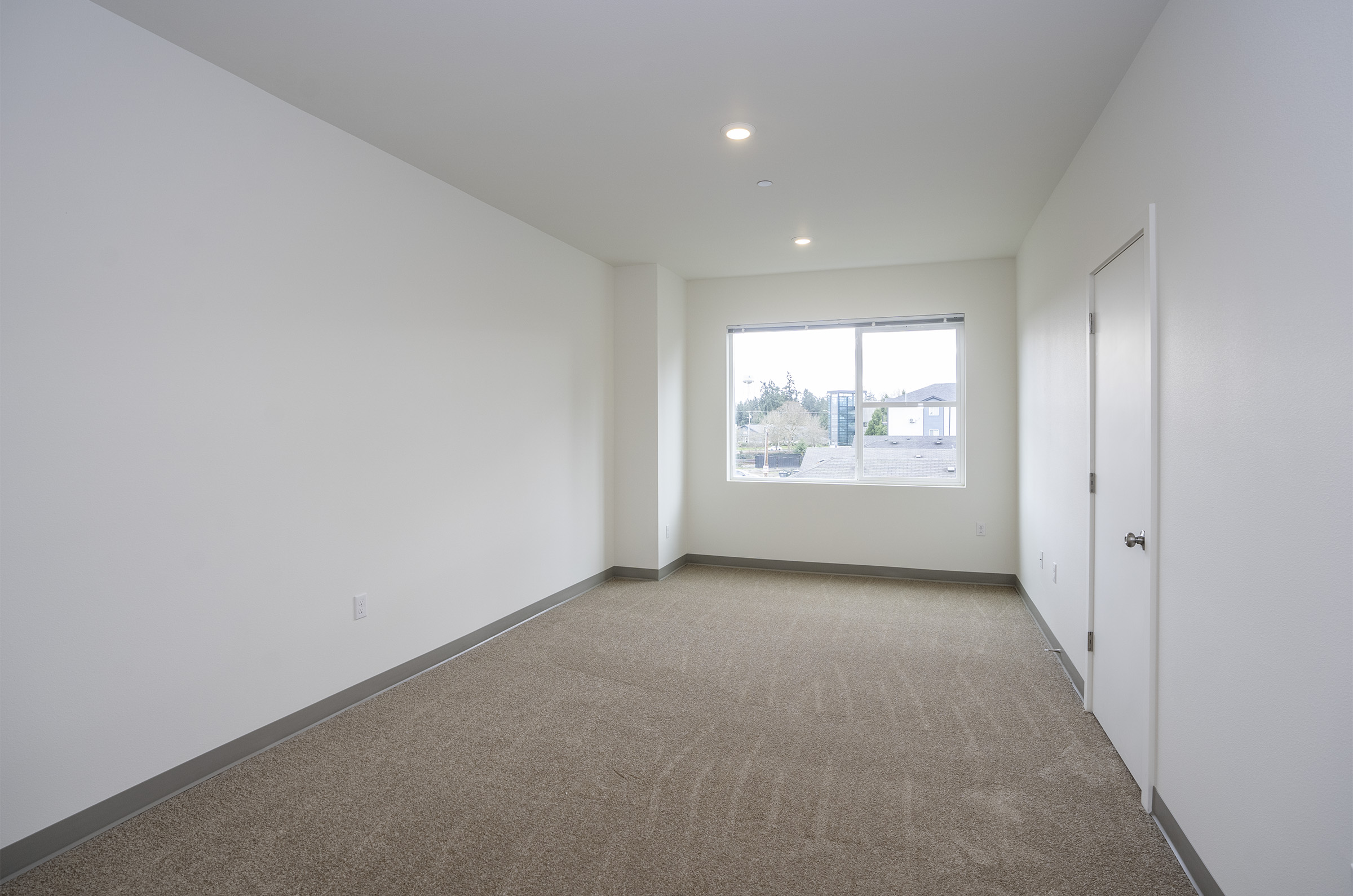 Lakewood Station bedroom with large window and natural light